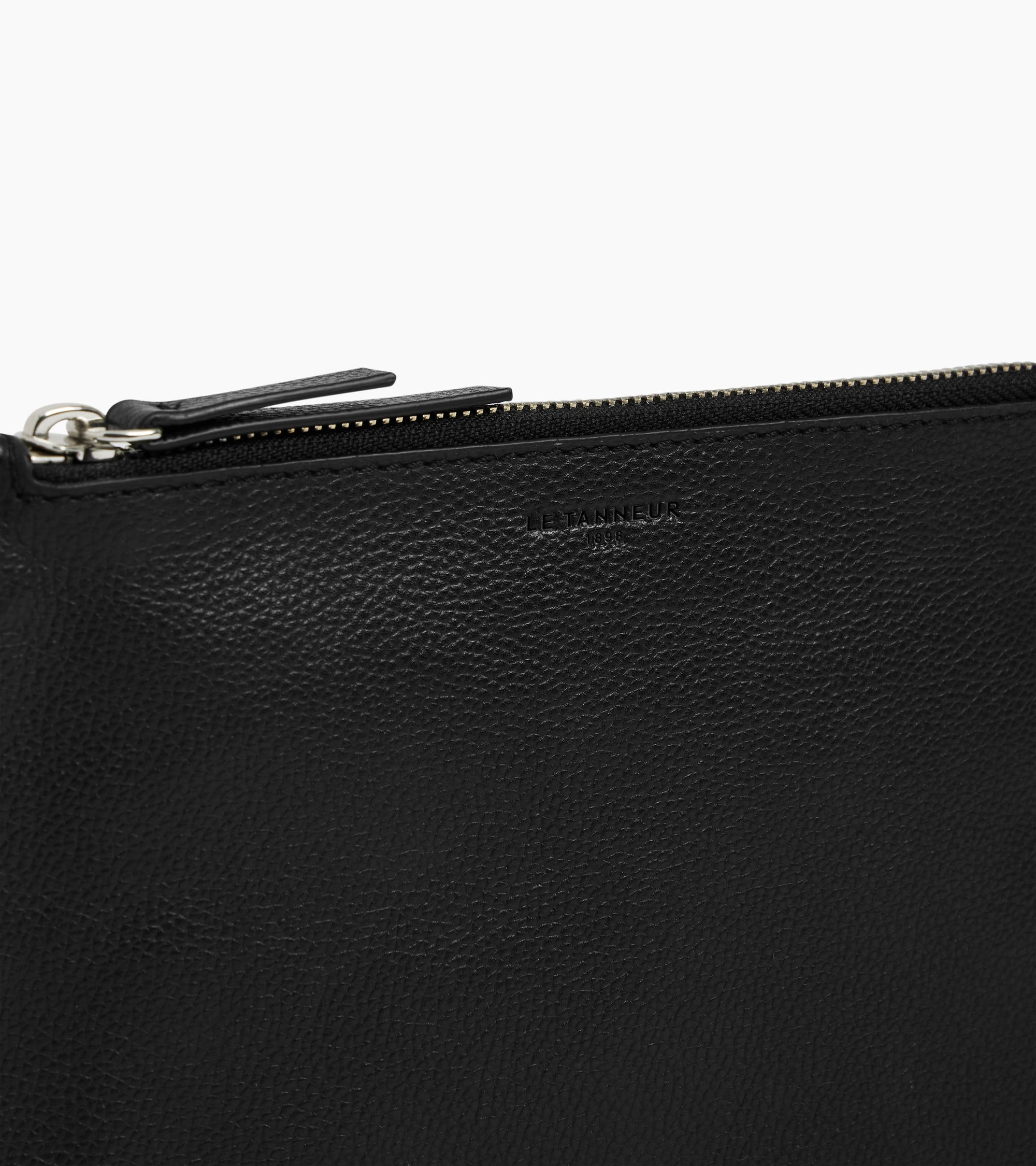 Zipped pouch with a grained leather strap